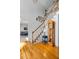 Open foyer showcasing hardwood floors, a staircase, and an antique grandfather clock at 4506 Westcliff Ne Trce, Roswell, GA 30075