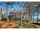 Charming brick home with blue shutters and a beautifully landscaped front yard at 4506 Westcliff Ne Trce, Roswell, GA 30075