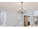 Bright foyer with plantation shutters, hardwood floors, and an elegant chandelier, offering a welcoming entrance at 4506 Westcliff Ne Trce, Roswell, GA 30075
