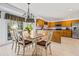 Sunlit kitchen boasts stainless appliances, island, and an adjacent dining area with access to the deck at 4506 Westcliff Ne Trce, Roswell, GA 30075