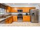 Well-lit kitchen featuring stainless appliances, granite countertops, and ample cabinet space at 4506 Westcliff Ne Trce, Roswell, GA 30075