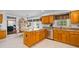 Spacious kitchen with granite counters, stainless appliances, an island, and an adjacent dining area at 4506 Westcliff Ne Trce, Roswell, GA 30075