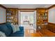 Elegant room with hardwood floors, built-in bookshelves, and French doors at 4506 Westcliff Ne Trce, Roswell, GA 30075