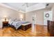 Spacious primary bedroom features trey ceiling, hardwood floors, and warm, natural light at 4506 Westcliff Ne Trce, Roswell, GA 30075