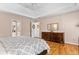 Spacious bedroom with hardwood floors, trey ceiling and a view of the ensuite bathroom at 4506 Westcliff Ne Trce, Roswell, GA 30075