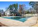 Backyard featuring a private pool area with a covered pool, deck, and manicured landscaping at 4506 Westcliff Ne Trce, Roswell, GA 30075