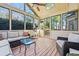 Relaxing sunroom with wicker furniture, wood floors, and plenty of natural light at 4506 Westcliff Ne Trce, Roswell, GA 30075