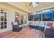 Cozy screened-in porch with wicker furniture and a skylight at 4506 Westcliff Ne Trce, Roswell, GA 30075