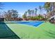 Community tennis courts, professionally surfaced and surrounded by mature trees for recreational enjoyment at 4506 Westcliff Ne Trce, Roswell, GA 30075