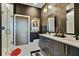 Modern bathroom featuring dual sinks, stylish fixtures, and a glass-enclosed shower at 112 Rogers Street Ne # 505, Atlanta, GA 30317
