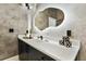 Stylish bathroom with a unique mirror, sleek vanity, and contemporary design elements at 112 Rogers Street Ne # 505, Atlanta, GA 30317