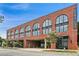 Brick Pullman Flats building with large arched windows and street view showcasing architectural details at 112 Rogers Street Ne # 505, Atlanta, GA 30317