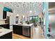 Spacious kitchen with black and white cabinetry, stainless steel appliances, and an open layout to the living area at 112 Rogers Street Ne # 505, Atlanta, GA 30317