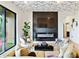 Inviting living room showcases a patterned ceiling, contemporary fireplace, and plush, comfortable seating arrangements at 112 Rogers Street Ne # 505, Atlanta, GA 30317