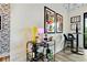 Stylish living area featuring a bar cart, modern art, and a dining table with chairs at 112 Rogers Street Ne # 505, Atlanta, GA 30317