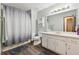 Bathroom featuring modern vanity and shower tub with decorative curtain at 251 Sabrina Ct, Woodstock, GA 30188
