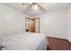 Bedroom featuring ceiling fan, carpeting, and access to additional bedrooms at 251 Sabrina Ct, Woodstock, GA 30188