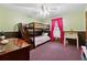 Bedroom with bunk beds, desk, ceiling fan and cozy purple carpet at 251 Sabrina Ct, Woodstock, GA 30188