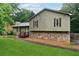 Charming home featuring a stone foundation and well-manicured lawn, creating a cozy curb appeal at 251 Sabrina Ct, Woodstock, GA 30188