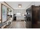 Efficient kitchen with white cabinets, and modern appliances at 251 Sabrina Ct, Woodstock, GA 30188