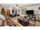 Open living room with stairs, piano, fireplace, and durable flooring at 251 Sabrina Ct, Woodstock, GA 30188