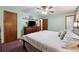 A large bed is the focal point of this relaxing bedroom with wood furnishings at 251 Sabrina Ct, Woodstock, GA 30188
