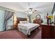 A spacious main bedroom features a large bed, dresser, and ample natural light at 251 Sabrina Ct, Woodstock, GA 30188