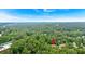 Scenic aerial of a tree-covered property near the city, marked with a location pin at 400 Old Ivy Ne Rd, Atlanta, GA 30342
