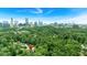 Beautiful aerial view of a home near the city surrounded by lush greenery at 400 Old Ivy Ne Rd, Atlanta, GA 30342