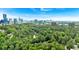 Panoramic aerial view showcasing lush greenery and the city skyline in the distance at 400 Old Ivy Ne Rd, Atlanta, GA 30342