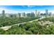 Stunning aerial view of city skyline surrounded by lush green trees and a neighborhood at 400 Old Ivy Ne Rd, Atlanta, GA 30342