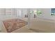 Finished basement with built in shelving, carpet, and light filled windows at 400 Old Ivy Ne Rd, Atlanta, GA 30342