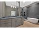 A luxurious bathroom with a freestanding tub, glass-enclosed shower, and modern fixtures at 400 Old Ivy Ne Rd, Atlanta, GA 30342