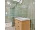 Modern bathroom with glass-enclosed shower and sleek vanity with storage drawers at 400 Old Ivy Ne Rd, Atlanta, GA 30342