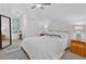 Bright bedroom featuring neutral tones, a ceiling fan, and comfortable furnishings at 400 Old Ivy Ne Rd, Atlanta, GA 30342