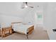 Cozy bedroom with light-colored carpet and a ceiling fan at 400 Old Ivy Ne Rd, Atlanta, GA 30342