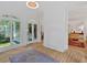 Bright entryway with hardwood floors, front door access, staircase and lots of windows at 400 Old Ivy Ne Rd, Atlanta, GA 30342