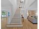 Spacious foyer with high ceilings, hardwood floors, and staircase to the second level at 400 Old Ivy Ne Rd, Atlanta, GA 30342