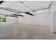 Spacious garage featuring epoxy flooring, multiple storage closets, and ample lighting at 400 Old Ivy Ne Rd, Atlanta, GA 30342