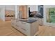 Spacious kitchen features a large island, modern appliances, and wood floors at 400 Old Ivy Ne Rd, Atlanta, GA 30342