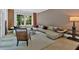 Comfortable living room featuring neutral tones, large sectional, and natural light at 400 Old Ivy Ne Rd, Atlanta, GA 30342