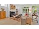 Cozy living room with fireplace, neutral decor, and natural light from the French doors at 400 Old Ivy Ne Rd, Atlanta, GA 30342