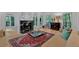 Bright living room with fireplace, hardwood floors, and stylish rug at 400 Old Ivy Ne Rd, Atlanta, GA 30342