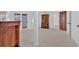 Bright living room with tile floors, exposed beam, and a door to the outside at 400 Old Ivy Ne Rd, Atlanta, GA 30342