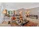 Large living room with hardwood floors, neutral paint, lots of natural light, and ample seating at 400 Old Ivy Ne Rd, Atlanta, GA 30342