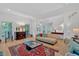 Bright living room with hardwood floors, staircase access, and comfortable seating at 400 Old Ivy Ne Rd, Atlanta, GA 30342