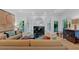 Open living room with hardwood floors, fireplace, and modern decor at 400 Old Ivy Ne Rd, Atlanta, GA 30342