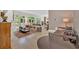 Spacious living room with open floor plan, tile flooring, and ample seating areas at 400 Old Ivy Ne Rd, Atlanta, GA 30342