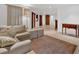 Open-concept living room featuring neutral tones, hardwood floors, and ample seating at 400 Old Ivy Ne Rd, Atlanta, GA 30342