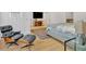 Well-appointed main bedroom features hardwood floors, neutral tones, and a cozy sitting area at 400 Old Ivy Ne Rd, Atlanta, GA 30342